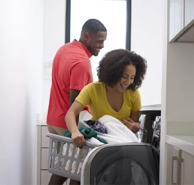 Couple happy to see their LifeSource water softener alternative system