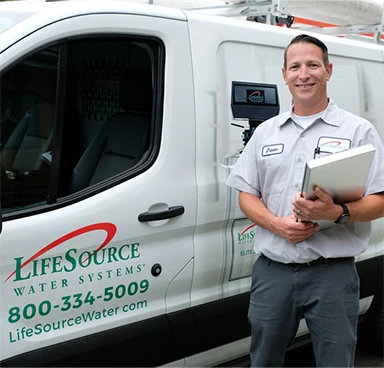 Couple happy to see their LifeSource water softener alternative system