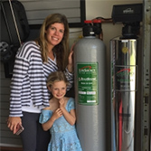 evan and amanda with their water tank